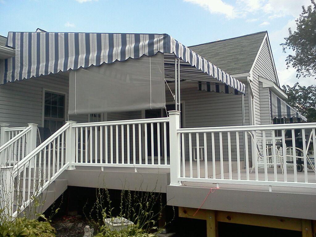 drop screen attached to a patio canopy