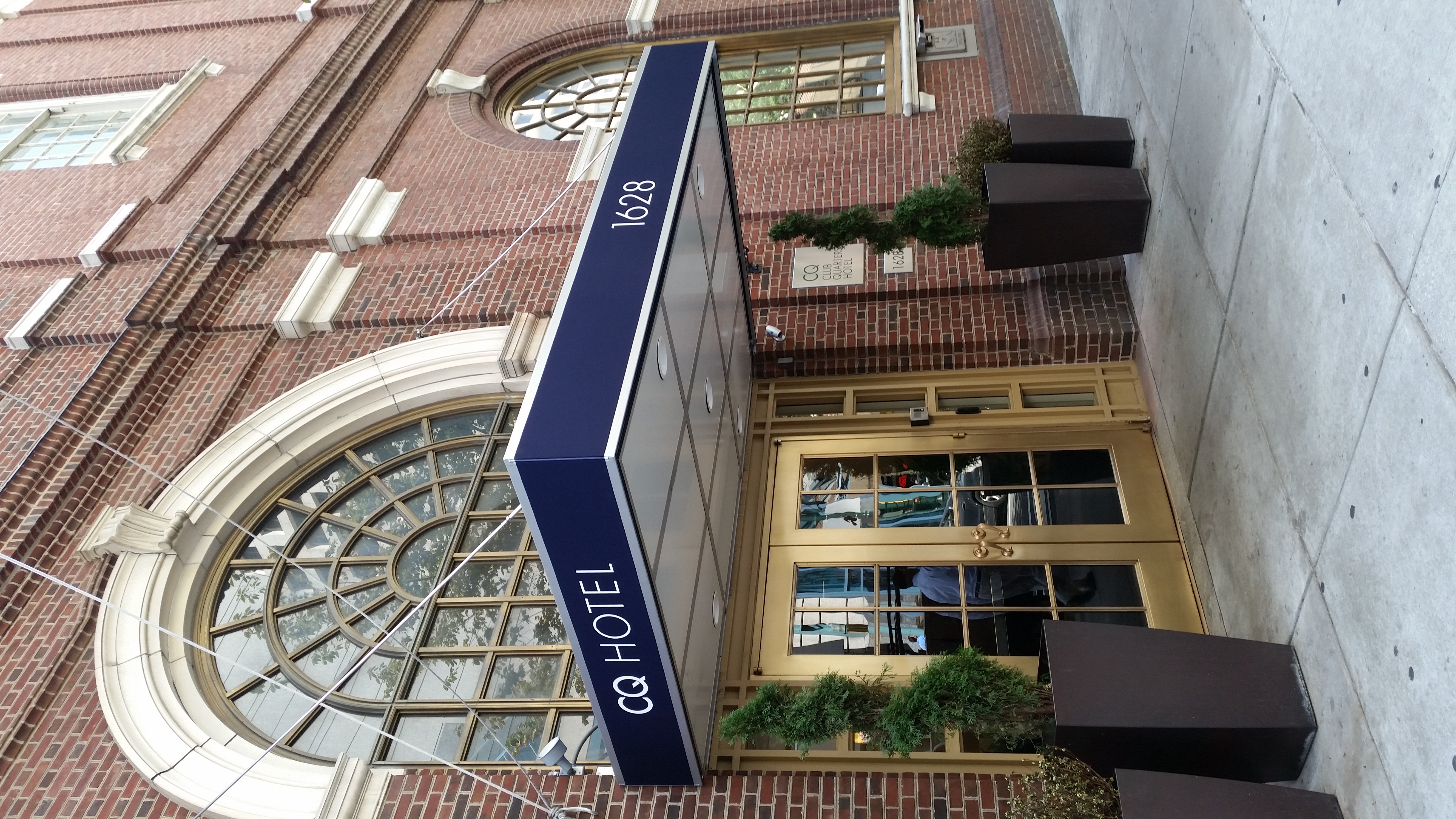 a metal entryway awning for a hotel