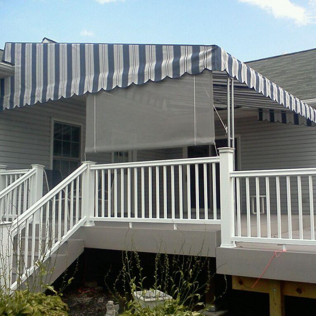 drop screen attached to a patio canopy