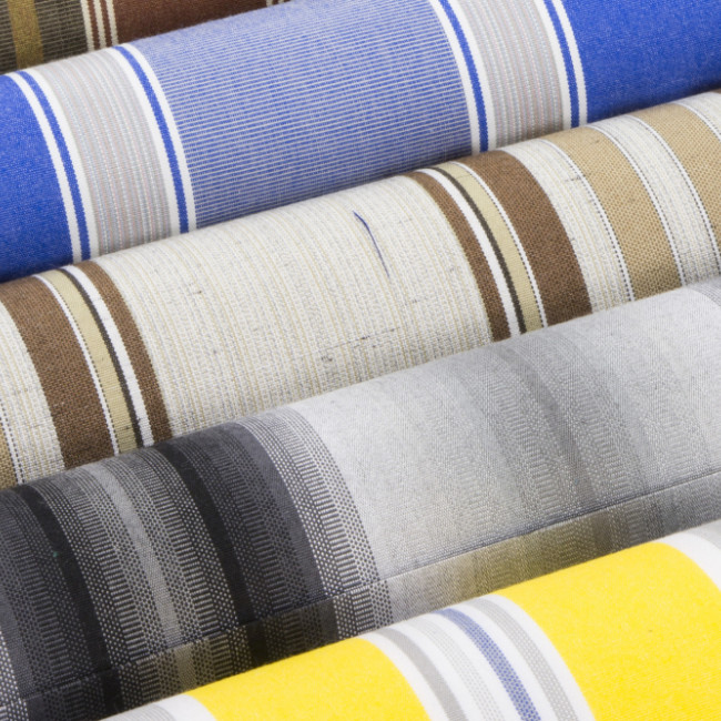 Stripe patterned fabrics rolled up
