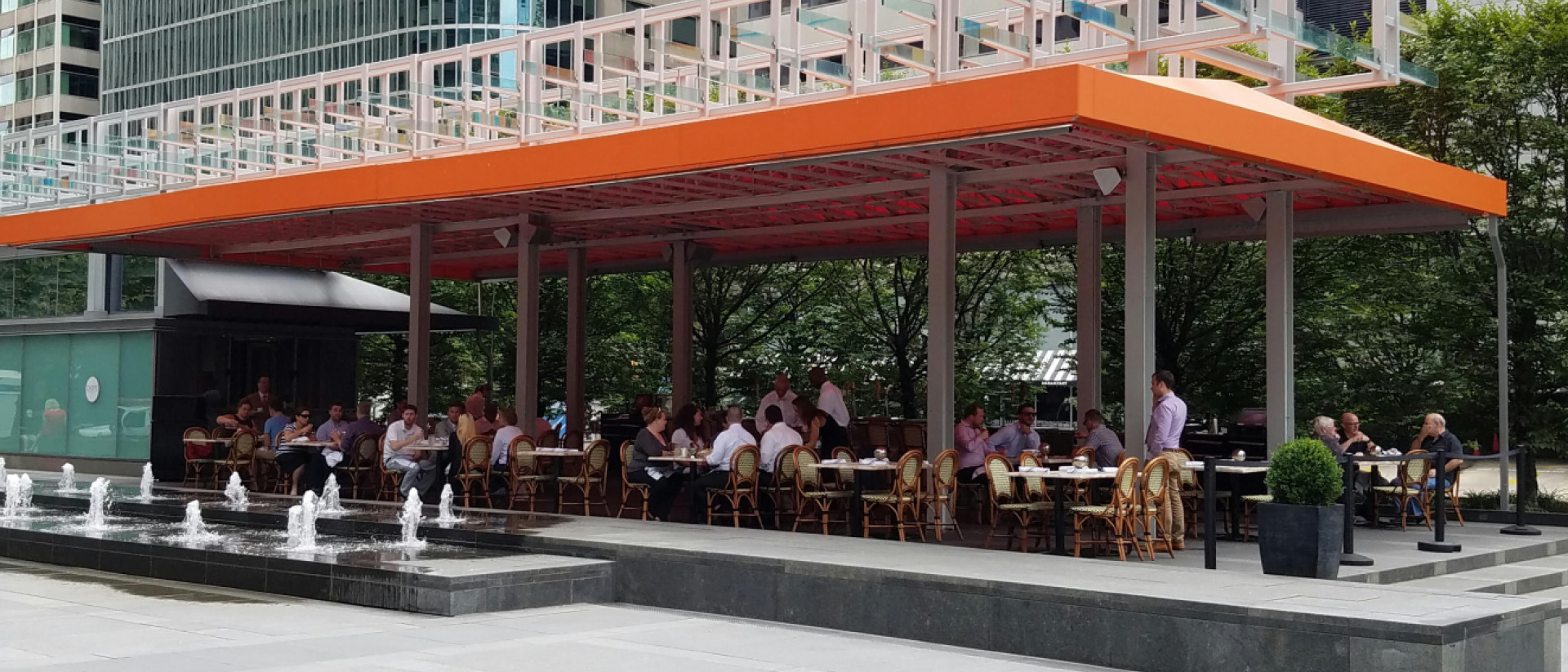 Outdoor restaurant patio with an orange awning